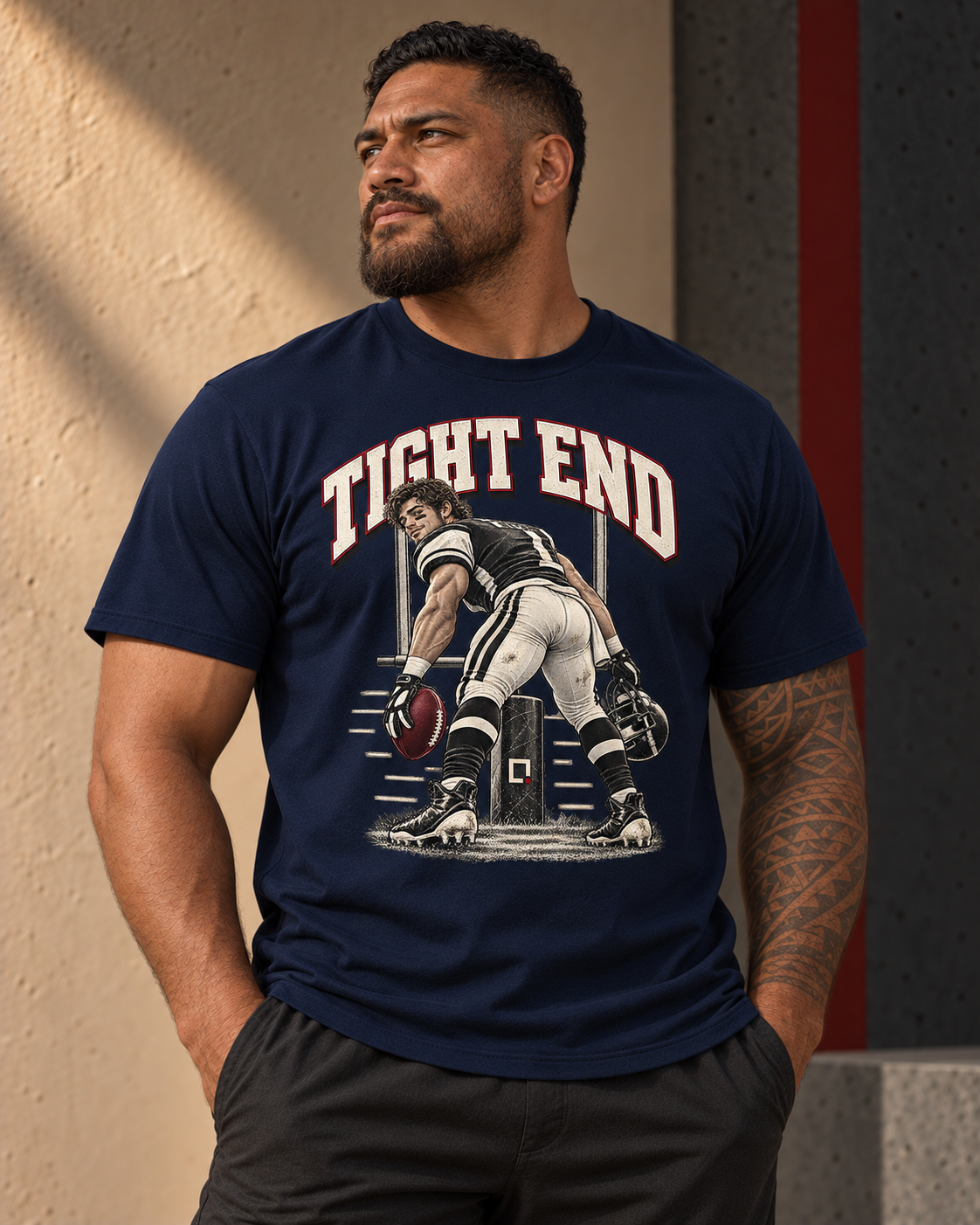 Model wearing a premium navy Tight End football graphic T-shirt.